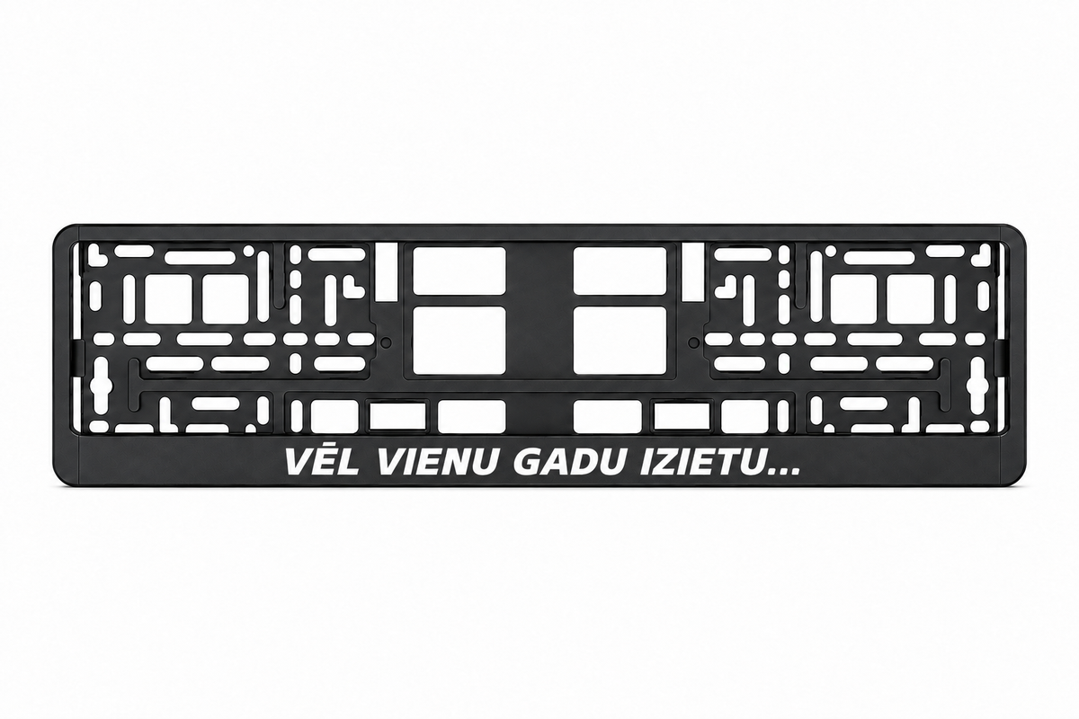 Чёрная рамка номерного знака VĒL VIENU GADU IZIETU...