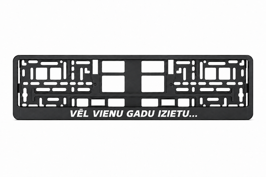 Чёрная рамка номерного знака VĒL VIENU GADU IZIETU...